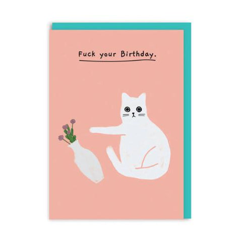 Pink card with design of white cat pushing over a vase of flowers. Text states 