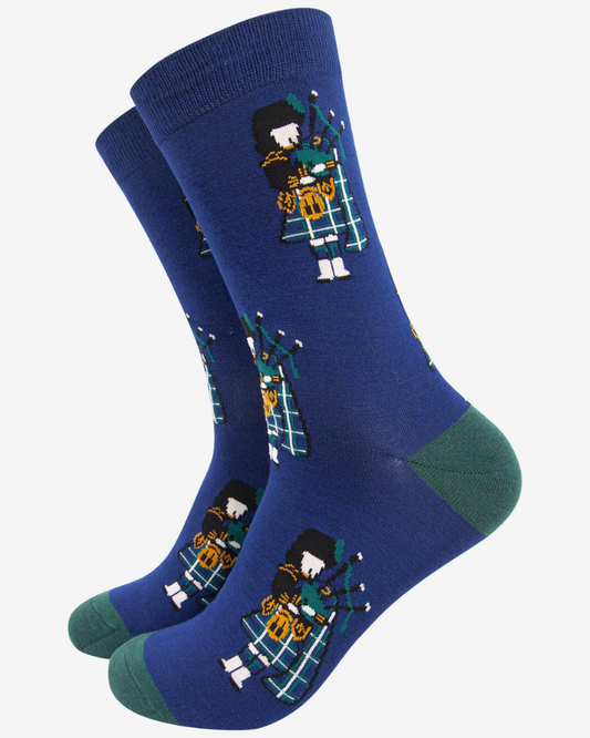 Blue socks with Scottish bagpipe player motifs,