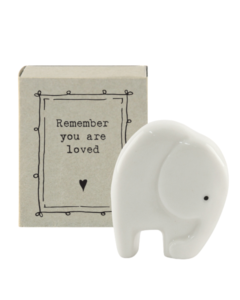 Standing at 4cm tall this little porcelain elephant is the perfect little gift for those you love!  Presented in a little match box with the message "Remember you are loved". A lovely keepsake for anyone in need of some kind words.  Collect them all.  Comes in a mini gift box.