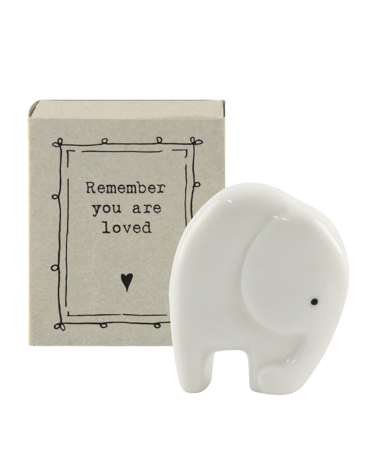 Standing at 4cm tall this little porcelain elephant is the perfect little gift for those you love!  Presented in a little match box with the message "Remember you are loved". A lovely keepsake for anyone in need of some kind words.  Collect them all.  Comes in a mini gift box.